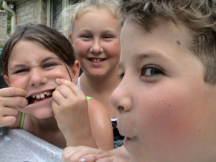 Three kids in a hot tub