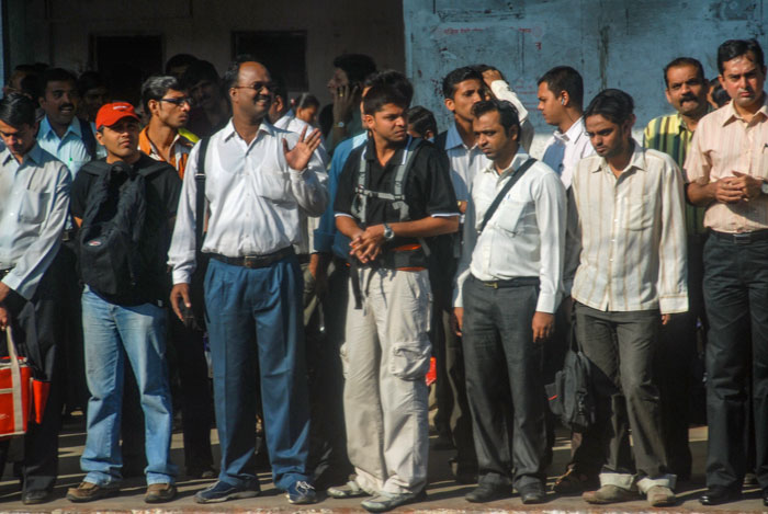 Men waiting on commuter platform